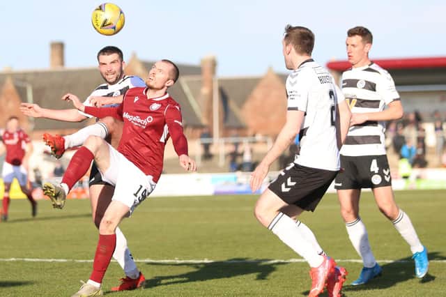 Craig Wighton of Arbroath keeps a careful eye on the ball (picture by Graham Black)