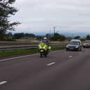 The Queen’s cortege makes its way along the A90 near Forfar.