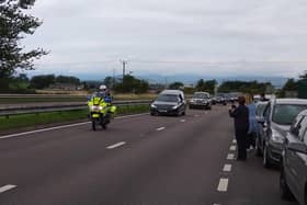 The Queen’s cortege makes its way along the A90 near Forfar.
