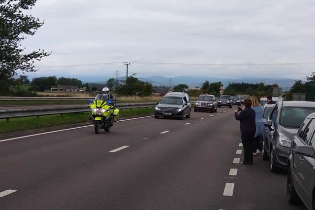 The Queen’s cortege makes its way along the A90 near Forfar.