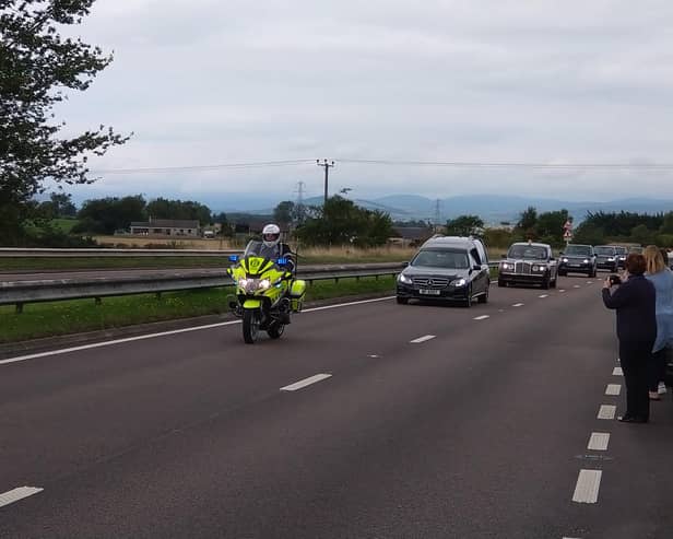 The Queen’s cortege makes its way along the A90 near Forfar.
