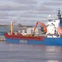Haugesund-registered cargo ship Norvind loading logs at Montrose.​