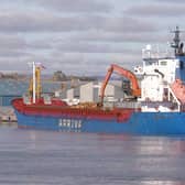 Haugesund-registered cargo ship Norvind loading logs at Montrose.​