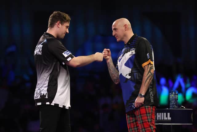 Alan Soutar of Scotland and Callan Rydz after their fourth round match during the William Hill World Darts Championship at Alexandra Palace. Photo by Luke Walker/Getty Images