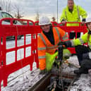 Robert Thorburn (centre) watches engineers Lucy Kennedy and Jodine Crombie as they work on Scotland’s new full fibre network.