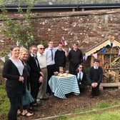 Pupils and guests are pictured at the opening of the Kirrie Connections bughouse. The pupils also prepared and served their own snacks during the morning.