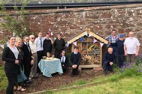 Pupils and guests are pictured at the opening of the Kirrie Connections bughouse. The pupils also prepared and served their own snacks during the morning.