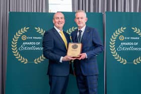 Glamis Castle general manager Steven Cumming (right) receives the award from Stephen Cotter of CIE Tours. (Pic:Michal Wachucik/Abermedia)