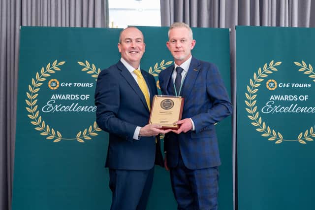 Glamis Castle general manager Steven Cumming (right) receives the award from Stephen Cotter of CIE Tours. (Pic:Michal Wachucik/Abermedia)