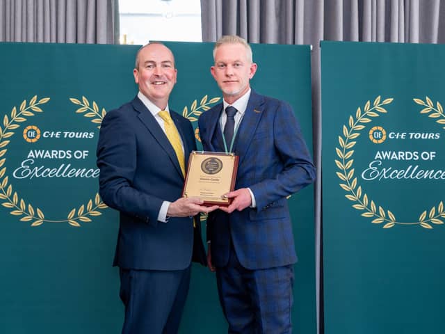 Glamis Castle general manager Steven Cumming (right) receives the award from Stephen Cotter of CIE Tours. (Pic:Michal Wachucik/Abermedia)