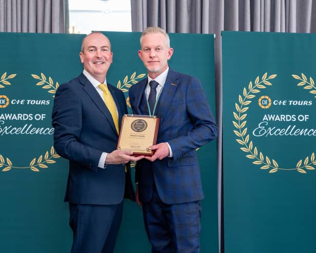 Glamis Castle general manager Steven Cumming (right) receives the award from Stephen Cotter of CIE Tours. (Pic:Michal Wachucik/Abermedia)