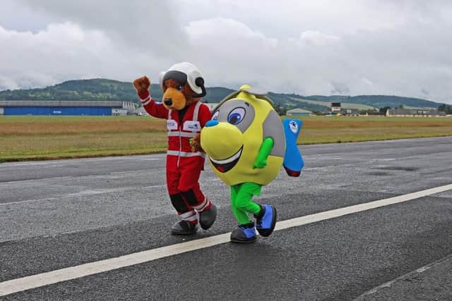 SCAA mascots Nevis and Whirly sample Run The Runway experience.