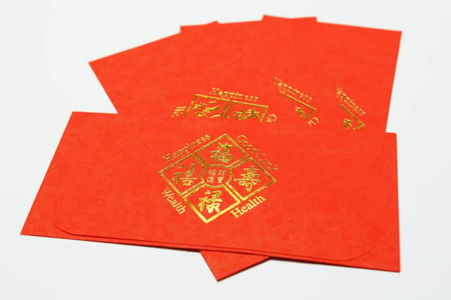 Red money envelopes are considered a lucky gift.