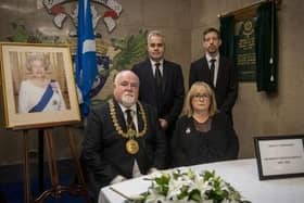 Lord Provost Bill Campbell, Lady Provost Yvonne Campbell, council leader John Alexander and chief executive Greg Colgan with the Book of Condolence.