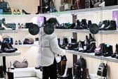 Stock image of a woman browsing in a shop.
