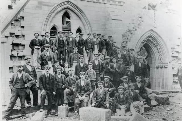Workers are during the 1900-1902 restoration of the cathedral building.