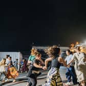 Over 100 crew members from around 30 countries joined in the ceilidh on the dockside beside the Mercy Ship.