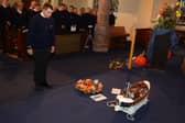 ​Volunteer coxswain Michale Marr lays a wreath on behalf of Broughty Ferry’s lifeboat crew. The church service was conducted by Rev Nick Baker and Rev Chris Hay. (Wallace Ferrier)
