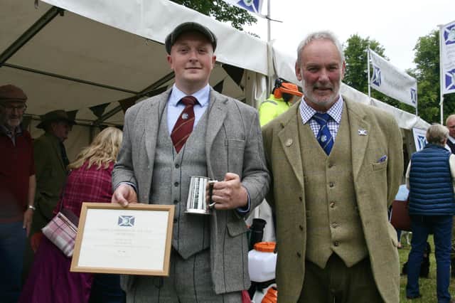 Finlay Shand is pictured with Alan Hogg after receiving his award.