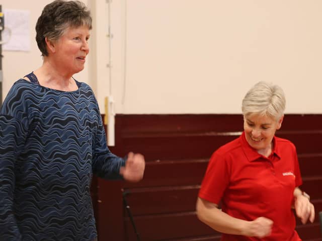 A range of physical activities is available through online and face-to-face sessions. Laura Mowbray is pictured with coach Pam Strachan.