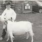Guilden Polly was the Champion Goat at the 1996 Angus Show. Polly was being held by Blair Yule.