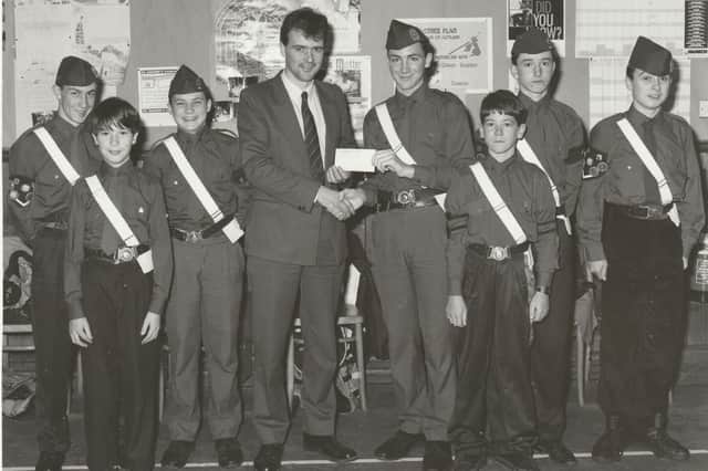 In October, 1992, Mark Guild of Guildglaze, Forfar, presented a cheque for £50 to Neil Smith of 7th Arbroath Boys' Brigade for distributing leaflets. Pictured were, from left - Ewan Smart, Greg Tutchner, Ewan Smith, Mr Guild, Neil Smith, James Skene, Michael Clark and Kevin Beattie.
