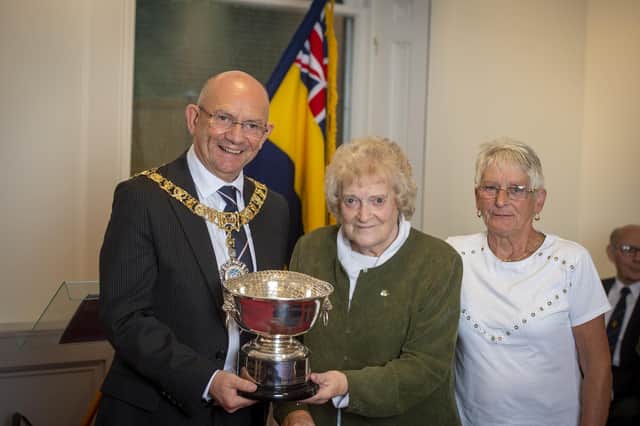 Kirsty MacDonald and Alison Carle, from the Carnoustie branch of Legion Scotland, accept the award from Lord Provost Robert Aldridge.