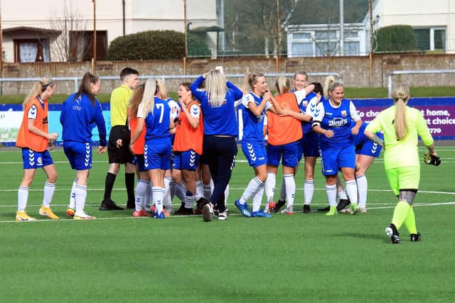 The Montrose players celebrate as the full-time whistle confirms their title win. Pic by Phoenix Photography