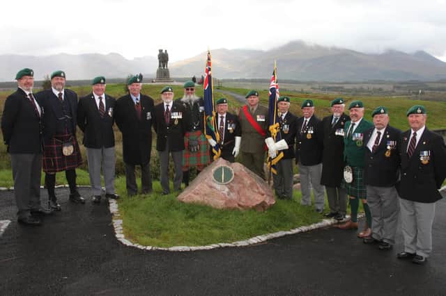 Former serving Royal Marines unveiled the plaque dedicated to memorial sculptor Scott Sutherland. (Wallace Ferrier)