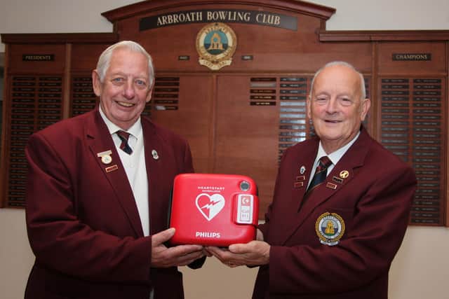 Pictured with the new defibrillator are Doug Skene (left) and Kenny Southorn, Arbroath Bowling Club President. (Wallace Ferrier)