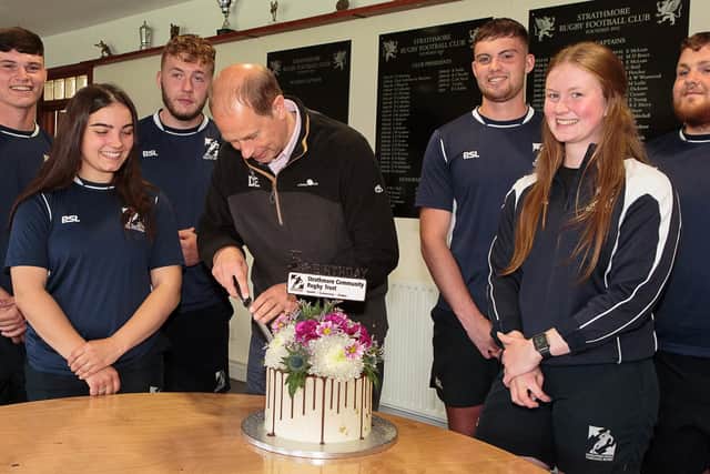 HRH The Earl of Forfar cut the trust’s 5th birthday cake after talking to (left) Community Project Worker Blair Butchart and young Community Project Assistants about how the trust has developed them in their rugby, into coaches and project assistants and as people. They are (from second left) Lily Campbell, Hamish Cumming, Euan Duguid, Mia White and Arron Jackson.