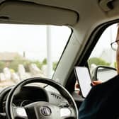 Safety experts at RoadAngel have suggested drivers’ mobiles should be confiscated if they’re caught using them at the wheel. (Pexels)