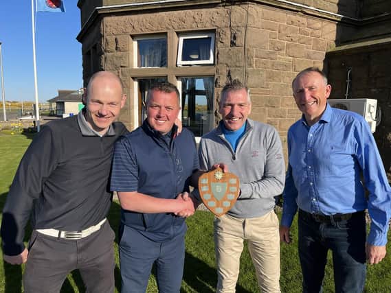 MFC manager Stewart Petrie (centre right) presenting the trophy to winning captain and MCT Chief Exec Peter Davidson with team members Nik Faulkner (left), Jamie Pert (right) and Chris Masson (not pictured).
