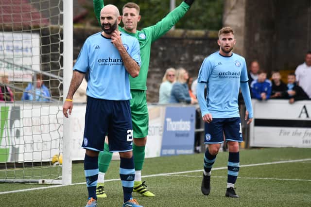 Forfar Athletic's Craig Slater, right, with Gary Harkins and goalkeeper Marc McCallum, had an effort cleared off the line at Cliftonhill against Albion Rovers