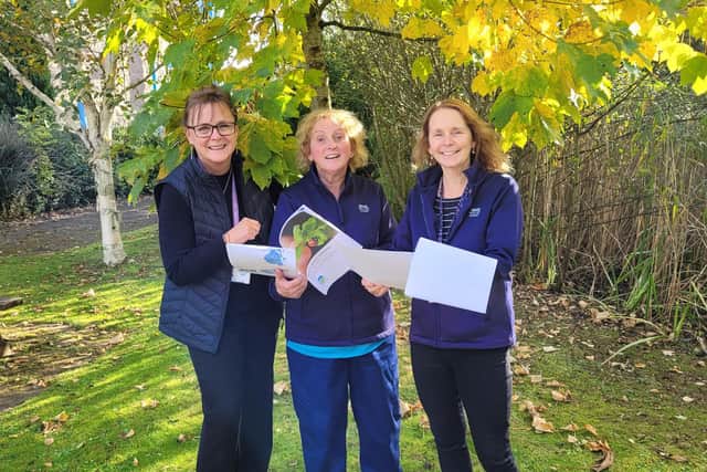 ​Lorna Strachan and occupational therapists Lynn Borrie and Lynne Hughes with the staff guide.