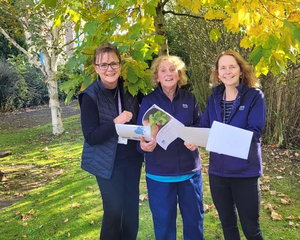 ​Lorna Strachan and occupational therapists Lynn Borrie and Lynne Hughes with the staff guide.