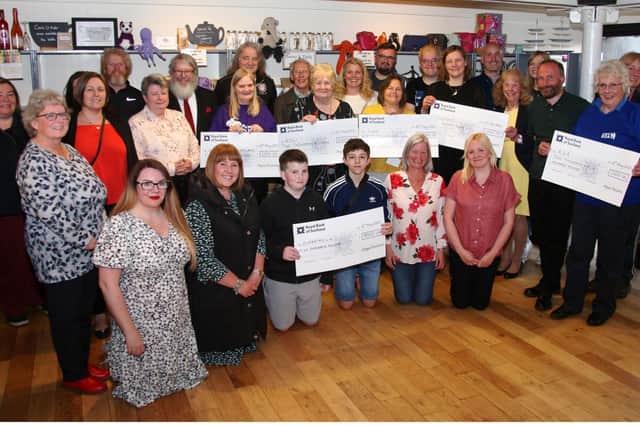 Pictured are representatives from the minstrels and the charities which received donations. (Wallace Ferrier)