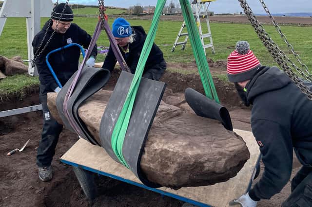 Team members carefully remove the rare stone from its resting place in a field near Aberlemno. It is now undergoing further analysis.
