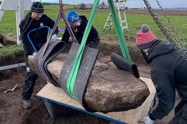 Team members carefully remove the rare stone from its resting place in a field near Aberlemno. It is now undergoing further analysis.