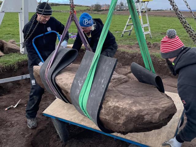 Team members carefully remove the rare stone from its resting place in a field near Aberlemno. It is now undergoing further analysis.
