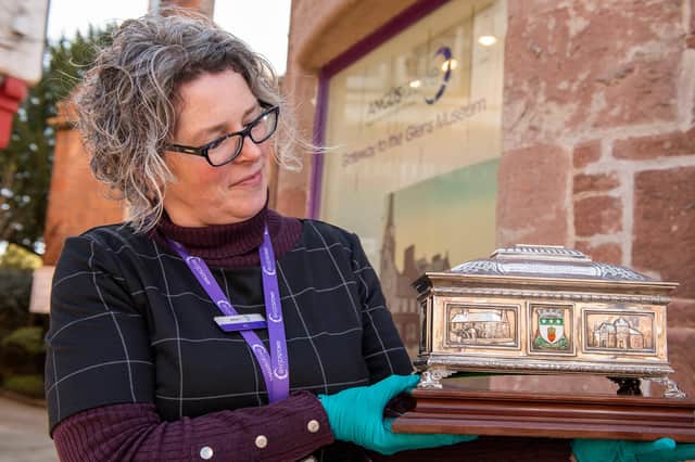 Jen Falconer with the Freedom Casket which contained the ticket offering Sir J M Barrie the Freedom of Kirriemuir. (Andy Thompson)
