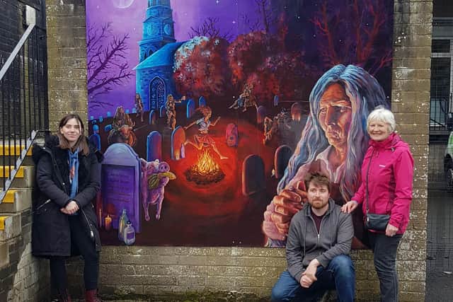 Councillor Lynne Devine and artists Andrew Rose and Kayleigh Skye Esplin are pictured with the new mural.
