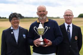 Ronnie Clark got his hand on the trophy for the second time. Pic by Scottish Golf