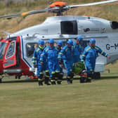 The casualty is transferred from the Coastguard helicopter to an ambulance to be taken to Ninewells Hospital in Dundee.