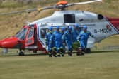 The casualty is transferred from the Coastguard helicopter to an ambulance to be taken to Ninewells Hospital in Dundee.