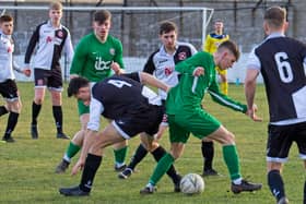 Roselea's Sam Garnham on the ball as Fergus Alberts watches on. Pic by Mal Turnbull