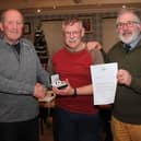 Chairman Dave Barton (left) and president Barry Barnwell with Malcolm.