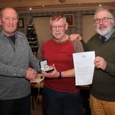Chairman Dave Barton (left) and president Barry Barnwell with Malcolm.