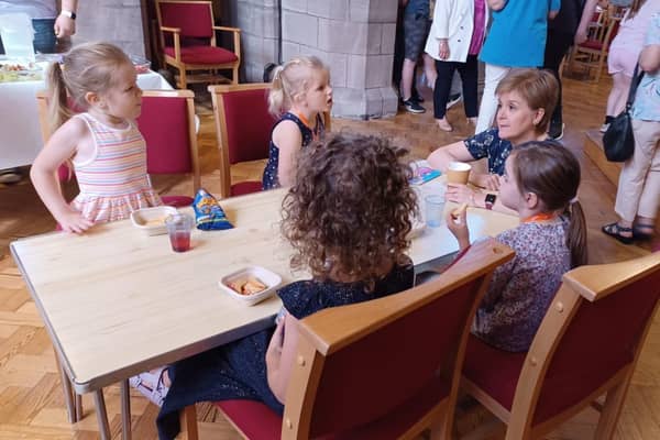First Minister Nicola Sturgeon meets children at the breakfast club.