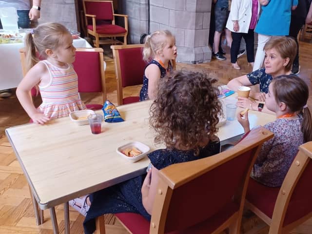 First Minister Nicola Sturgeon meets children at the breakfast club.